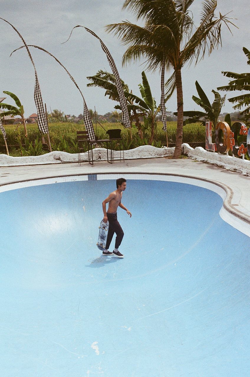 MAN IN SWIMMING POOL