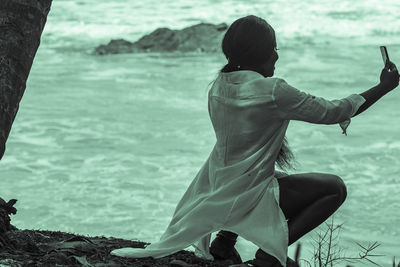 Rear view of woman on beach