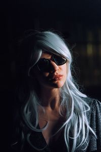Young woman with dyed hair wearing sunglasses
