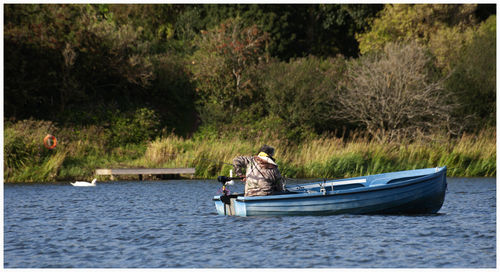 Piloting a small boat in the forfar loch.