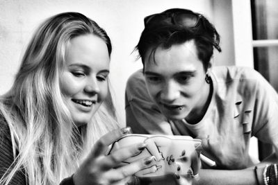 Close-up of young couple holding hands