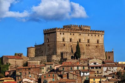 Low angle view of fort against blue sky