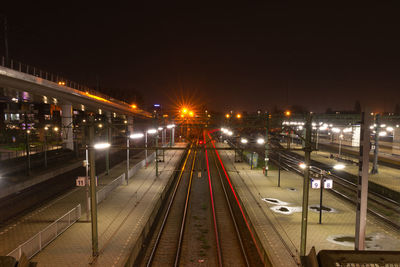 High angle view of railroad tracks at night