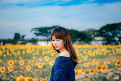 Beautiful woman standing on field