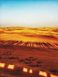 Scenic view of desert against clear sky