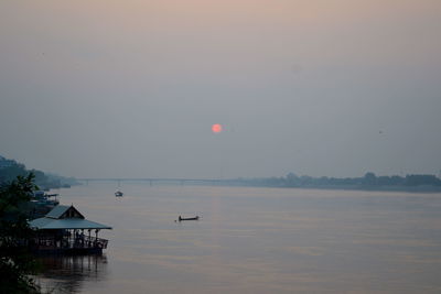 Scenic view of sea at sunset