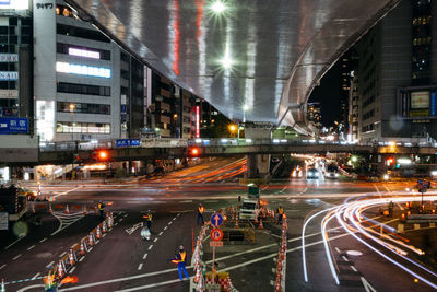 Light trails on road in city at night