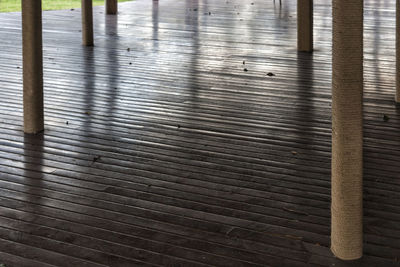 Close-up of wooden railing in water