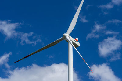 Low angle view of wind turbine against sky