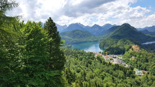 High angle view of lake amidst trees against sky