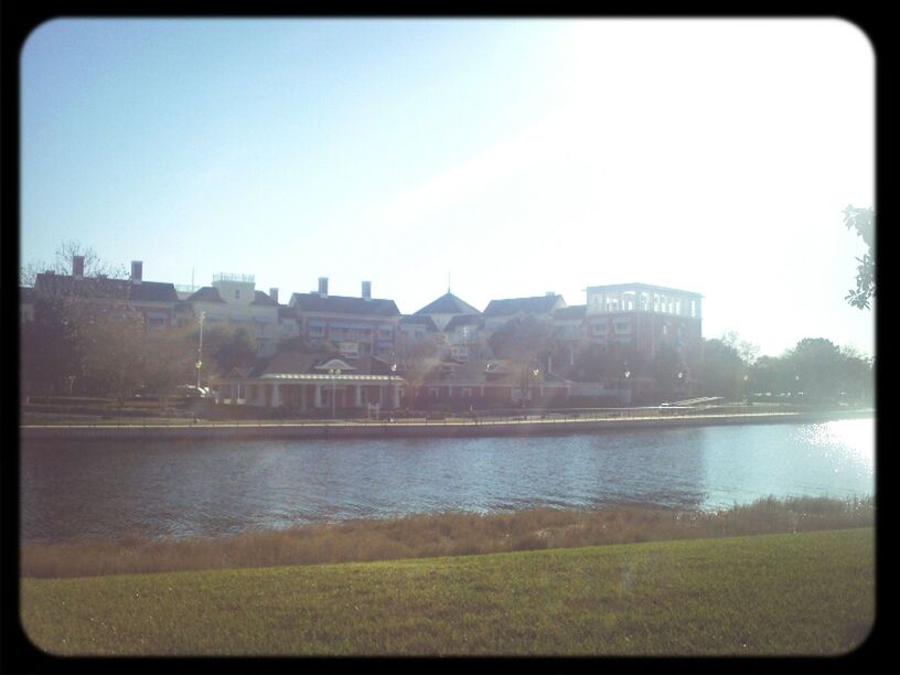 transfer print, clear sky, building exterior, water, architecture, built structure, auto post production filter, copy space, river, lake, waterfront, reflection, city, day, grass, outdoors, nature, sky, sunlight, no people