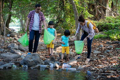 Family cleaning up forest