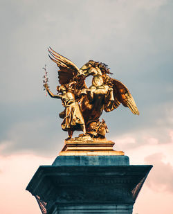 Low angle view of statue against sky