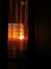 Close-up of window at sunset