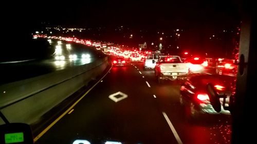 Cars on road in city at night