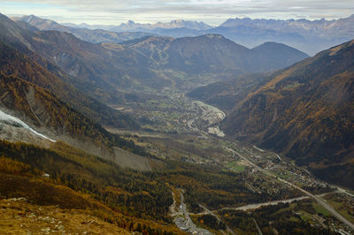 High angle view of land and mountains against sky