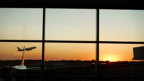 Close-up of airport runway against sky during sunset