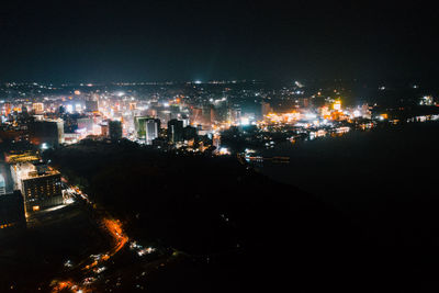 High angle view of illuminated buildings in city at night