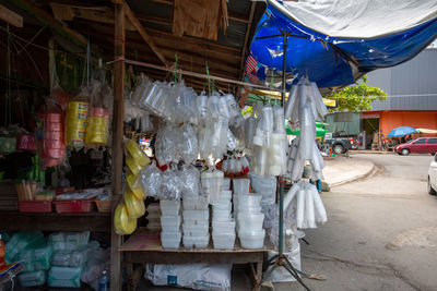 Clothes hanging for sale at market stall