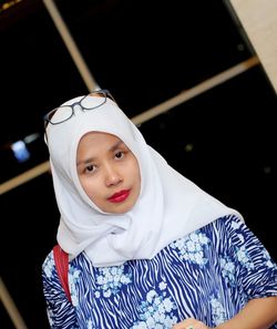 Portrait of young woman wearing white hijab