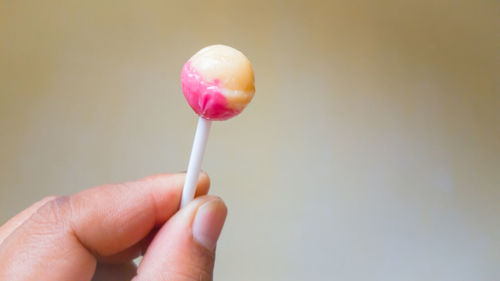 Close-up of hand holding ice cream