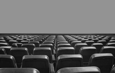 Empty seats and projection screen in movie theater