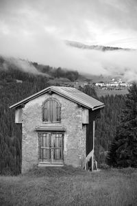 House on field against sky