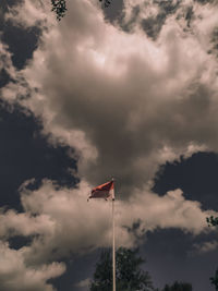 Low angle view of flag against sky