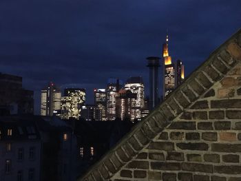 Low angle view of skyscrapers lit up at night