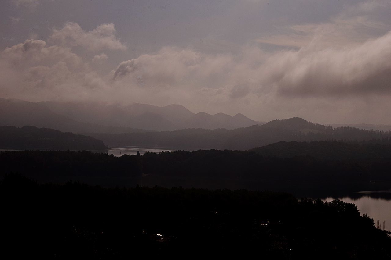 beauty in nature, tranquility, cloud - sky, mountain, tranquil scene, scenics - nature, sky, silhouette, no people, non-urban scene, environment, landscape, nature, tree, idyllic, mountain range, outdoors, remote, plant