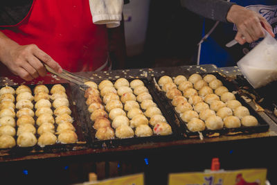 Man preparing food at store