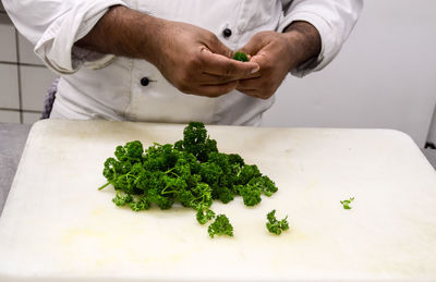 Close-up of man preparing food