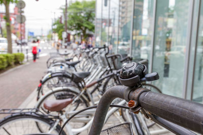 Close-up of bicycle on street in city