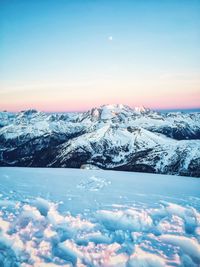 Scenic view of snow covered mountains against sky