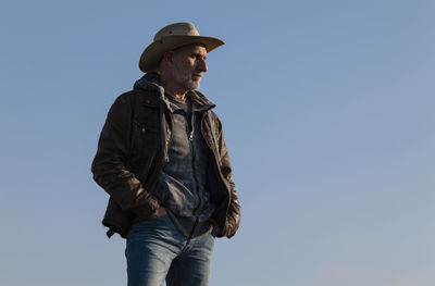 Adult man in cowboy hat in tabernas desert, almeria, spain