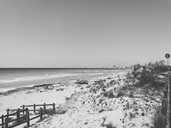 Scenic view of beach against clear sky