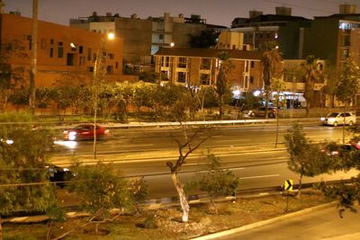 Cars on street in city at night