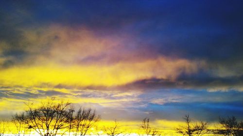 Scenic view of landscape against sky at sunset