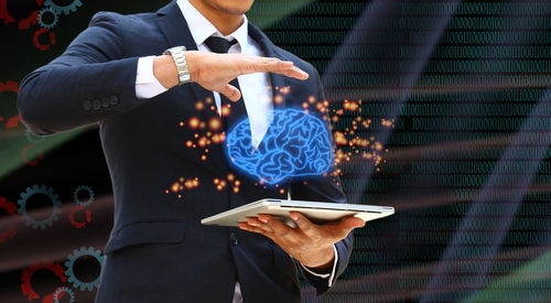 Low section of man holding mobile phone