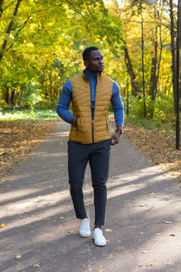 Full length of young man standing on road