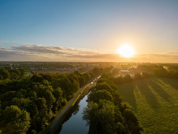 High angle view of countryside landscape against sky during sunset