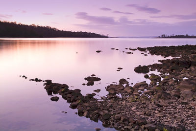 Scenic view of lake against sky during sunset