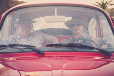 Portrait of couple sitting in car