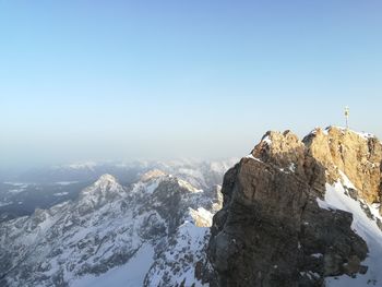 Scenic view of snowcapped mountains against clear sky