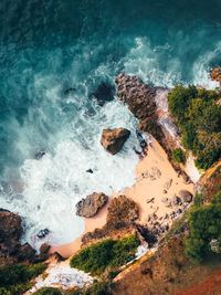 High angle view of rock in sea