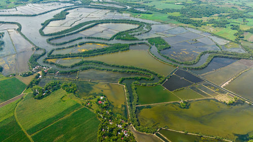 Aerial drone of river among rice fields and farmland. hinigaran river. negros, philippines