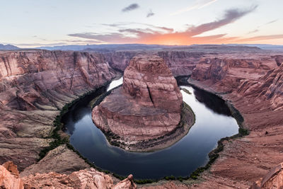 Scenic view of rock formations at sunset