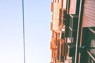 Low angle view of buildings against clear sky