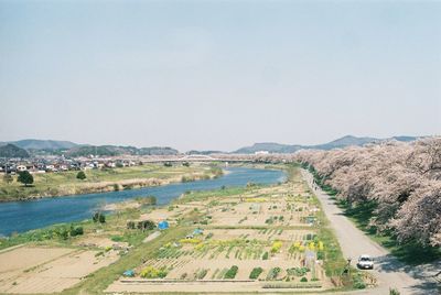 High angle view of river flowing through rural landscape