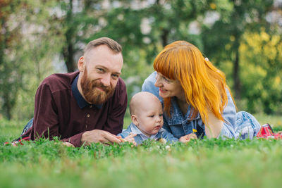 Portrait of friends against plants